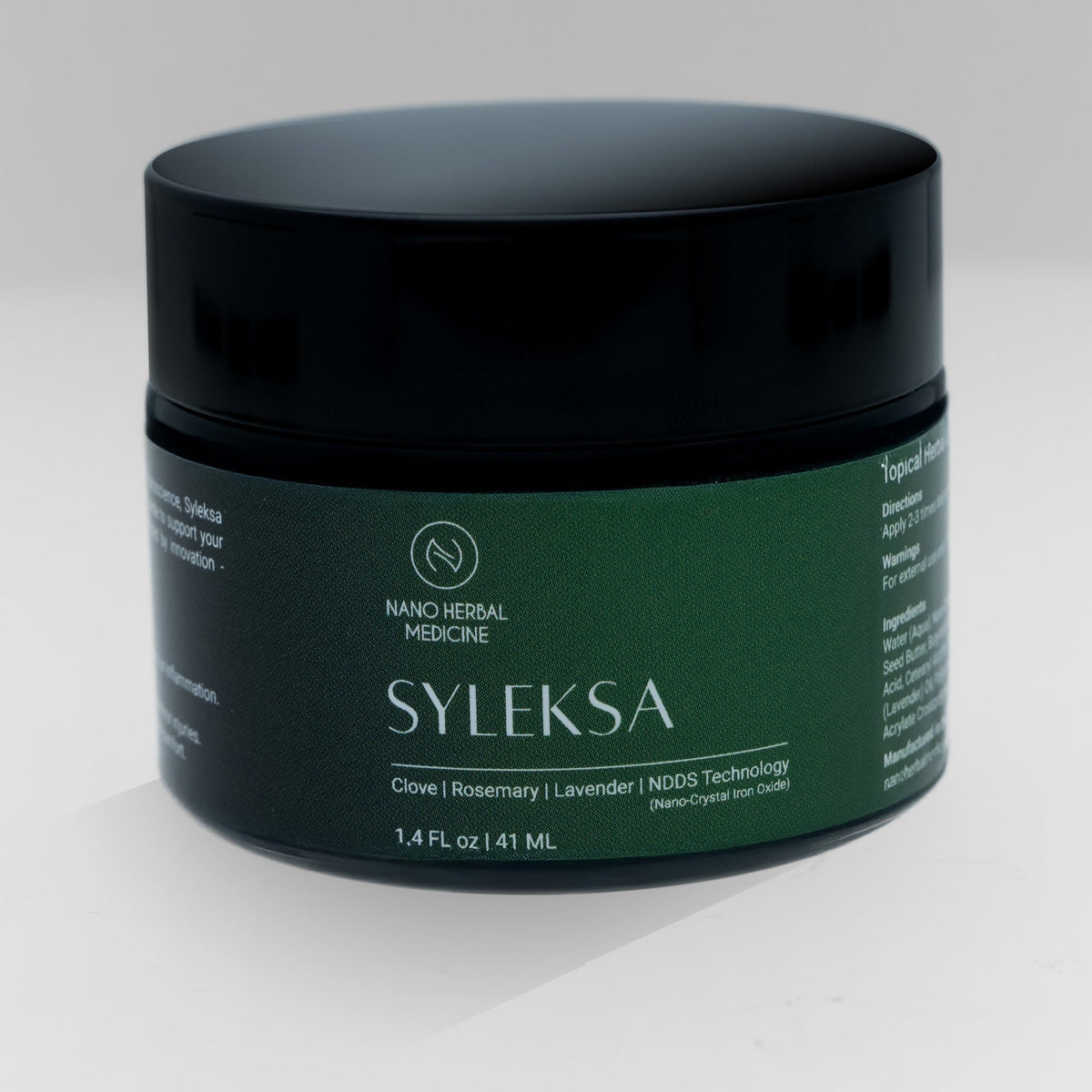 SYLEKSA Nano Herbal Cream jar — matte black lid and deep green label, on a clean white background