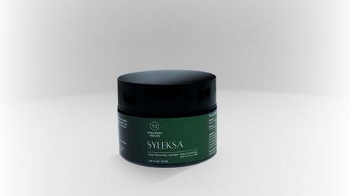 SYLEKSA Nano Herbal Cream — 1.4 fl oz jar with matte black lid and deep green label, studio shot