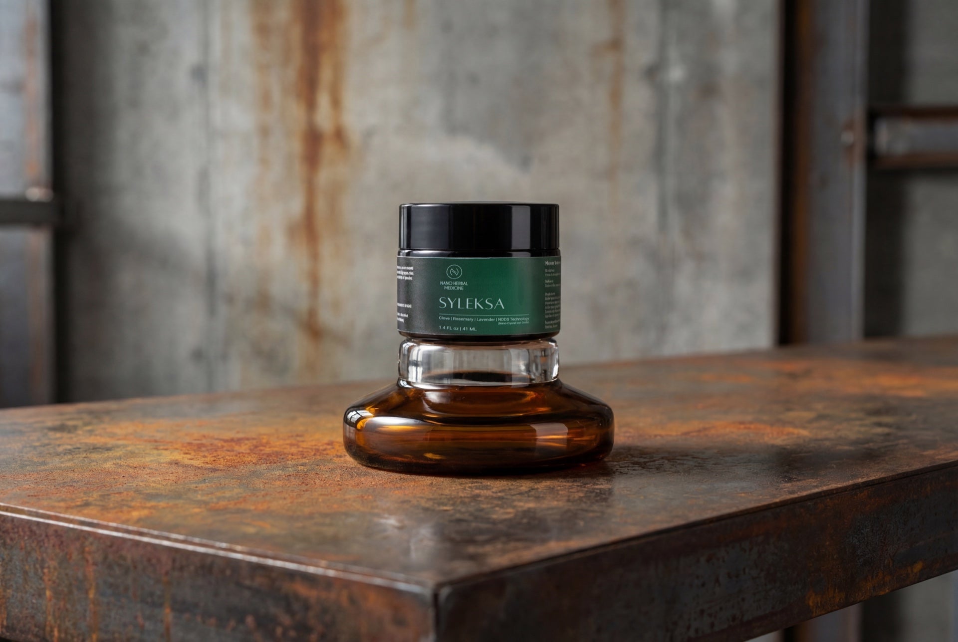 SYLEKSA Nano Herbal Cream — amber glass jar on bronze surface